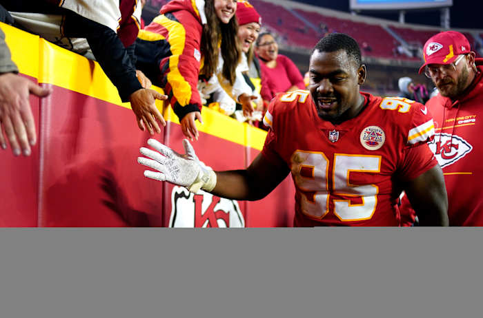 Nov 1, 2021; Kansas City, Missouri, USA; Kansas City Chiefs defensive end Chris Jones (95) celebrates with fans in the stands after defeating the New York Giants at GEHA Field at Arrowhead Stadium. Mandatory Credit: Jay Biggerstaff-USA TODAY Sports