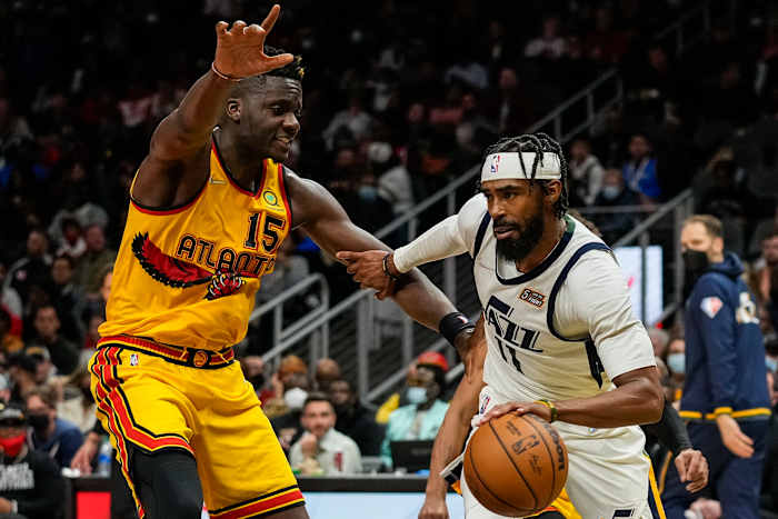 Hawks center Clint Capela defends Jazz guard Mike Conley.