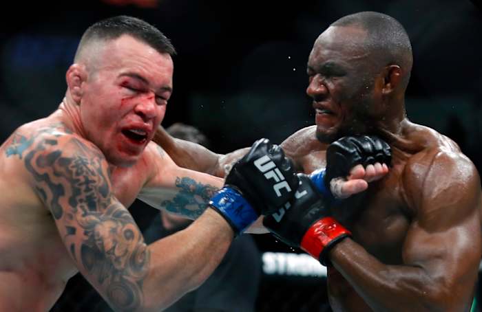 Usman and Covington during their first fight, in 2019.