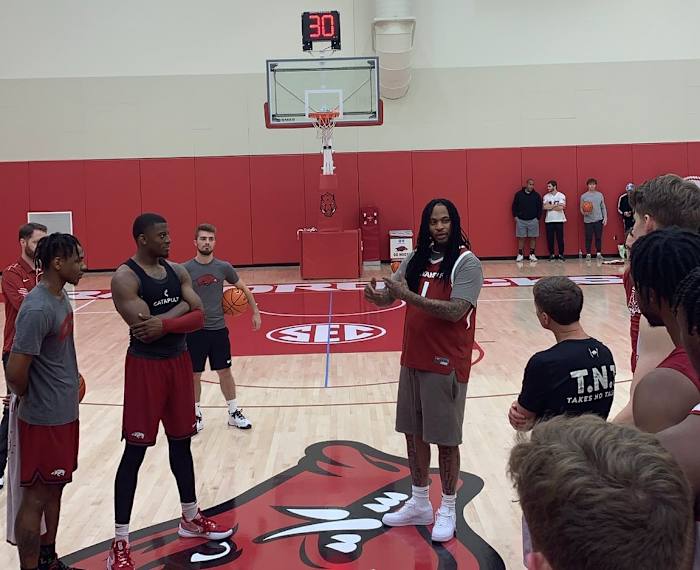 Waka Flocka Flame speaks to the Arkansas Razorbacks men's basketball team after practice.