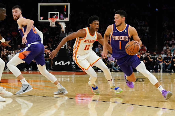 Phoenix Suns guard Devin Booker (1) drives to the basket against the Atlanta Hawks in the first half at Footprint Center.
