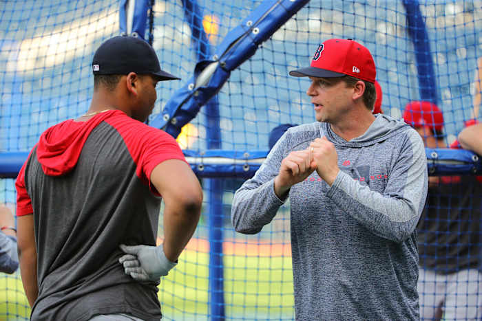 Jun 4, 2019; Kansas City, MO, USA; Boston Red Sox hitting coach Tim Hyers (51) talks with third baseman Rafael Devers (11) during batting practice before the game against the Kansas City Royals at Kauffman Stadium. Mandatory Credit: Jay Biggerstaff-USA TODAY Sports
