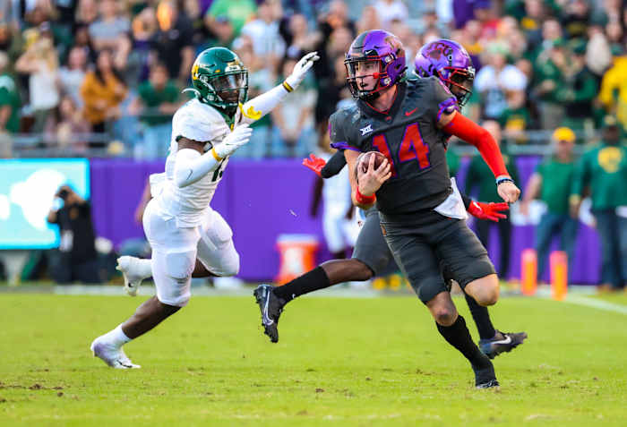 Nov 6, 2021; Fort Worth, Texas, USA; TCU Horned Frogs quarterback Chandler Morris (14) runs with the ball during the second half against the Baylor Bears at Amon G. Carter Stadium.
