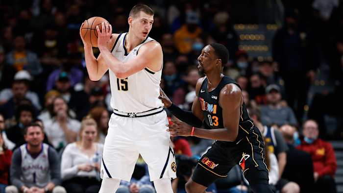 Denver Nuggets center Nikola Jokic (15) controls the ball as Miami Heat center Bam Adebayo (13) guards in the fourth quarter