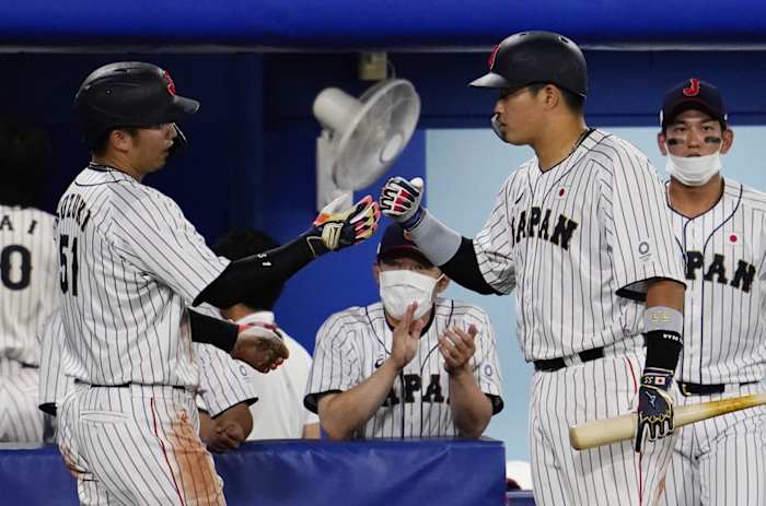 Aug 2, 2021; Yokohama, Japan; Team Japan outfielder Seiya Suzuki (51) celebrates after scoring a run against USA in a second round baseball game during the Tokyo 2020 Olympic Summer Games at Yokohama Baseball Stadium. Mandatory Credit: Mandi Wright-USA TODAY Sports