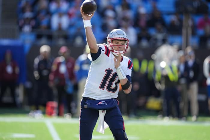 Nov 7, 2021; Charlotte, North Carolina, USA; New England Patriots quarterback Mac Jones (10) throws a pass during the second quarter against the Carolina Panthers at Bank of America Stadium. Mandatory Credit: Jim Dedmon-USA TODAY Sports