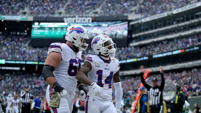Bills wide receiver Stefon Diggs (14) celebrates a touchdown against the New York Jets with center Mitch Morse (60) during the second quarter at MetLife Stadium.