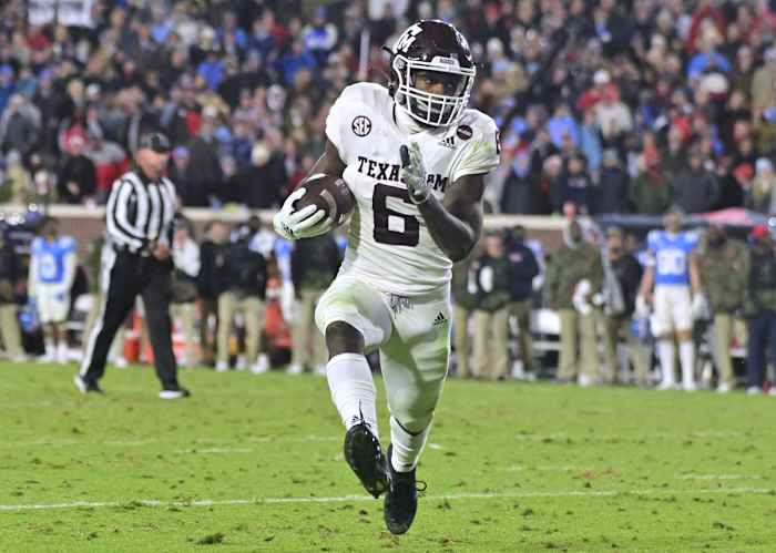 Nov 13, 2021; Oxford, Mississippi, USA; Texas A&amp;M Aggies running back Devon Achane (6) runs the ball against the Mississippi Rebels during the fourth quarter at Vaught-Hemingway Stadium. Mandatory Credit: Matt Bush-USA TODAY Sports