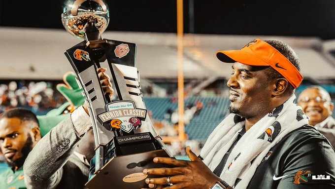 FAMU Coach Simmons hold Florida Classic Trophy