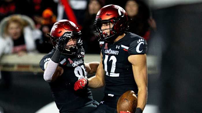 Cincinnati Bearcats wide receiver Alec Pierce (12) celebrates with Cincinnati Bearcats tight end Josh Whyle (81) after scoring a touchdown in the second half of the NCAA football game on Saturday, Nov...