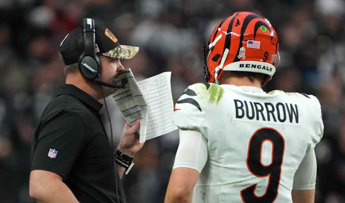 Nov 21, 2021; Paradise, Nevada, USA; Cincinnati Bengals head coach Zac Taylor (left) talks with quarterback Joe Burrow (9) the second half against the Las Vegas Raiders at Allegiant Stadium. Mandatory Credit: Kirby Lee-USA TODAY Sports