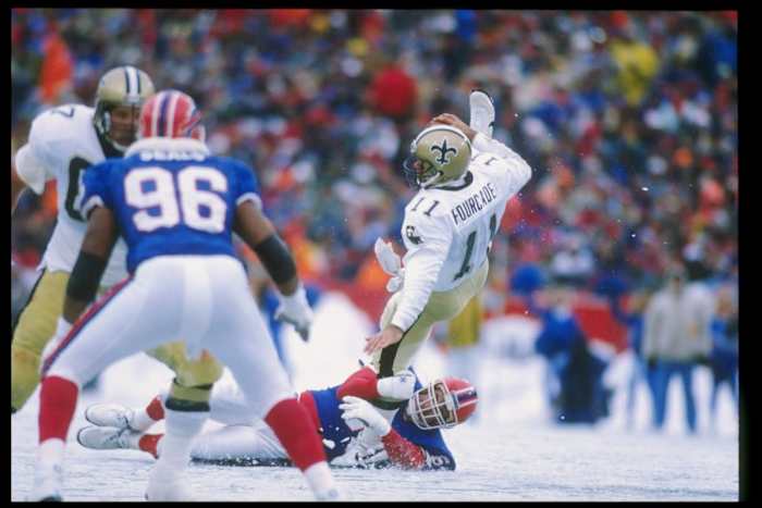 Saints QB John Fourcade is pressured as he throws against the Bills in 1989. Credit: USA TODAY