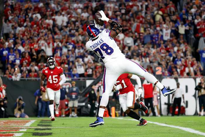 Nov 22, 2021; Tampa, Florida, USA;New York Giants offensive tackle Andrew Thomas (78) scores a touchdown against the Tampa Bay Buccaneers during the second quarter at Raymond James Stadium.