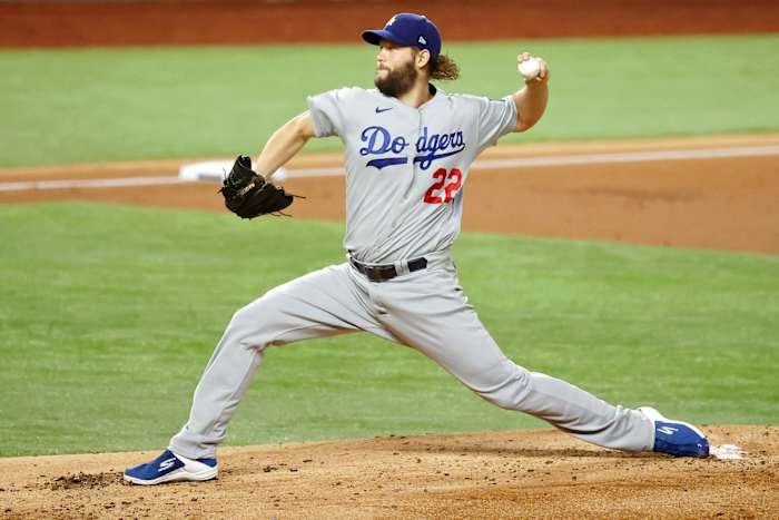 Oct 25, 2020; Arlington, Texas, USA; Los Angeles Dodgers starting pitcher Clayton Kershaw (22) pitches against the Tampa Bay Rays during the first inning during the first inning during game five of the 2020 World Series at Globe Life Field. Mandatory Credit: Kevin Jairaj-USA TODAY Sports