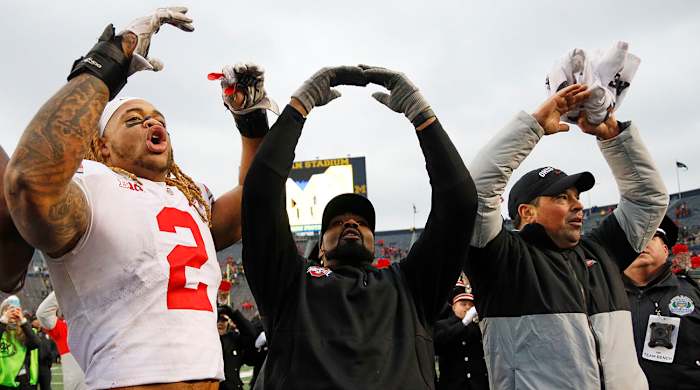 Chase Young (left), Al Washington and Day celebrate the 2019 win in Ann Arbor.