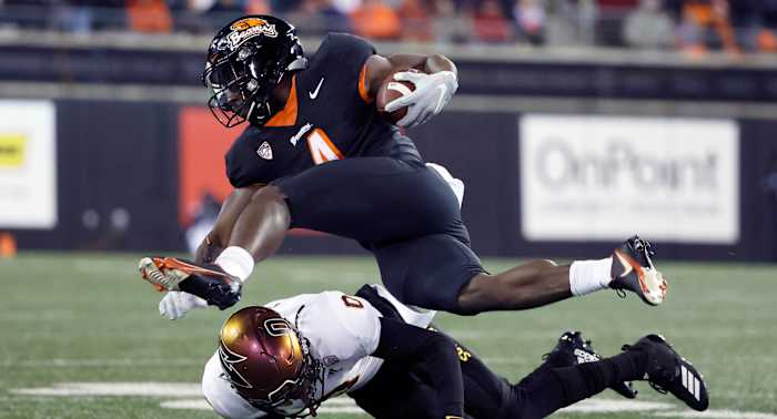 Oregon State Beavers running back B.J. Baylor (4) is tackled by Arizona State Sun Devils defensive back Jack Jones (0).