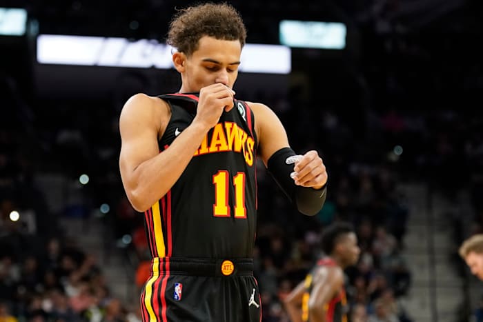 Atlanta Hawks guard Trae Young (11) kisses his uniform before the game against the San Antonio Spurs at AT&T Center.
