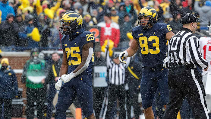 Michigan's Hassan Haskins celebrates a TD vs Ohio State