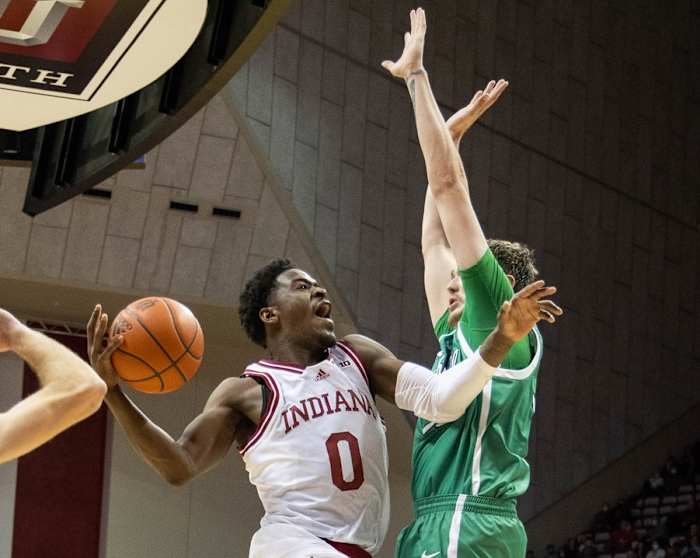 Indiana guard Xavier Johnson (0) shoots the ball while Marshall forward Mikel Beyers (31) defends during the Hoosiers' 90-79 win over Marshall. (Trevor Ruszkowski/USA TODAY Sports)