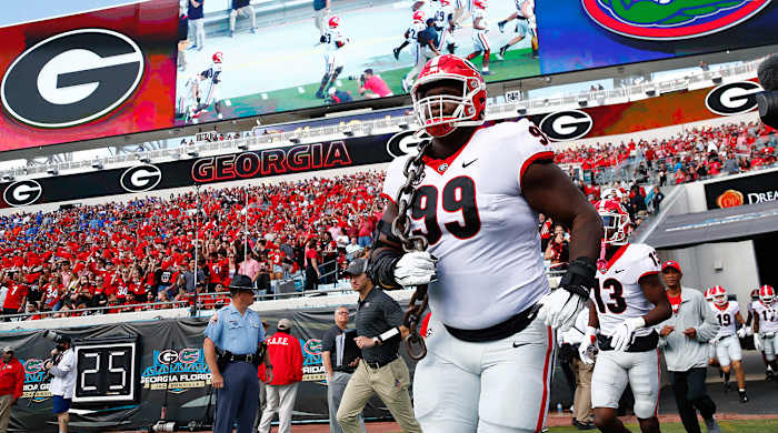 Georgia Bulldogs defensive lineman Jordan Davis runs out of the tunnel