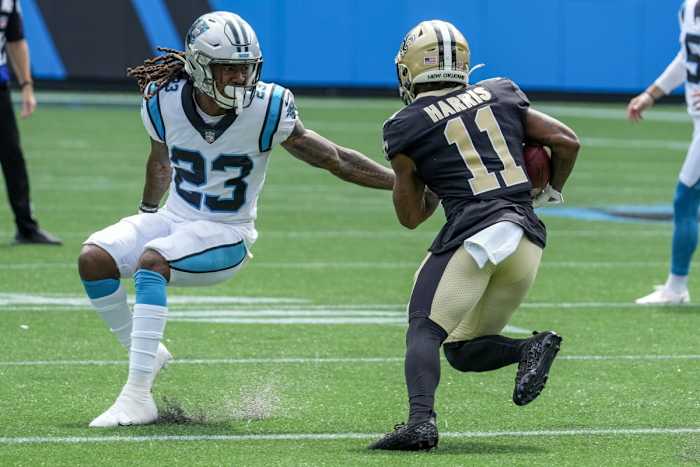 New Orleans Saints receiver Deonte Harris (11) tries to elude Carolina cornerback Stantley Thomas-Oliver III (23). Mandatory Credit: Jim Dedmon-USA TODAY Sports