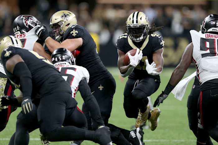 Nov 7, 2021; New Orleans Saints running back Alvin Kamara (41) jumps through a hole. Mandatory Credit: Chuck Cook-USA TODAY Sports