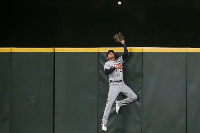 May 19, 2021; Seattle, Washington, USA; Detroit Tigers center fielder JaCoby Jones (21) jumps against the wall to catch a potential home run against the Seattle Mariners during the seventh inning at T-Mobile Park. Mandatory Credit: Joe Nicholson-USA TODAY Sports