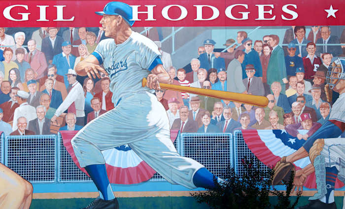 A 52' x 16' mural of Gil Hodges, painted by Randy Hedden, stands at the corner of Hwy 61 and Hwy 57 in Petersburg, Ind., Hodges' hometown. Hodges is portrayed as a player for the Brooklyn Dodgers (part of two World Series winning Dodgers teams – 1955 in Brooklyn and 1959 in Los Angeles) and manager for the New York Mets (captained the Miracle Mets to their first-ever World Series title in 1969).
