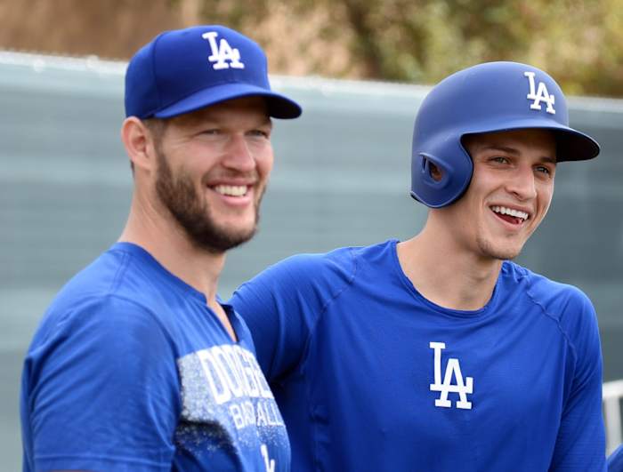 Feb 15, 2019; Glendale, AZ, USA; Los Angeles Dodgers starting pitcher Clayton Kershaw (left) and shortstop Corey Seager look on during a spring training workout at the Camelback Ranch practice fields. Mandatory Credit: Joe Camporeale-USA TODAY Sports