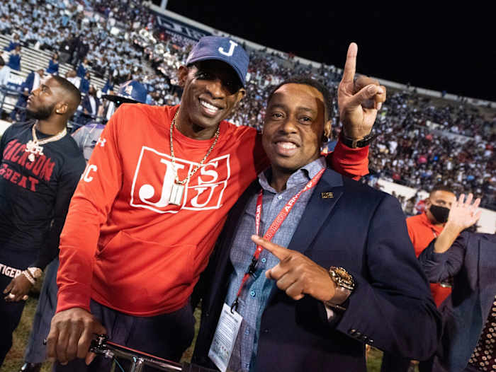 Jackson State head football coach Deion Sanders, left, and JSU Athletic Director Ashley Robinson