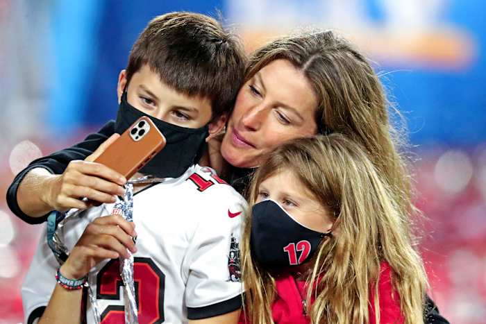 Tom Brady's son Ben, wide Gisele and daughter Vivian on the field after Super Bowl LV