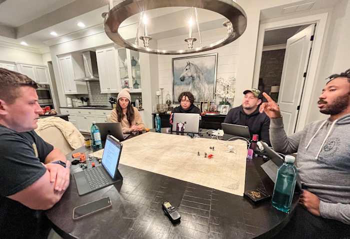 The Heathens look to their dungeon master, Stanton, for direction.