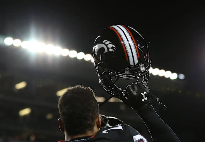 Nov 14, 2015; Cincinnati, OH, USA; Cincinnati Bearcats linebacker Eric Wilson (23) holds up his helmet after defeating the Tulsa Golden Hurricane 49-38 at Nippert Stadium. Mandatory Credit: Aaron Doster-USA TODAY Sports