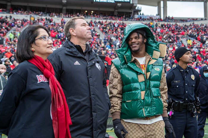 Louisville President Neeli Bendapudi attended a November ceremony to retire the jersey number of former Louisville quarterback Lamar Jackson. (Alton Strupp/Louisville Courier Journal)