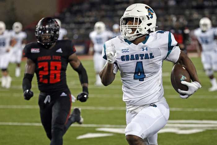 Oct 7, 2021; Jonesboro, Arkansas, USA; Coastal Carolina Chanticleers tight end Isaiah Likely (4) runs with the ball after a catch for a touchdown during the second half against the Arkansas State Red Wolves at Centennial Bank Stadium.