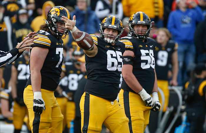 Iowa center Tyler Linderbaum signals a first down in the third quarter against Illinois on Saturday, Nov. 20, 2021, at Kinnick Stadium in Iowa City, Iowa.