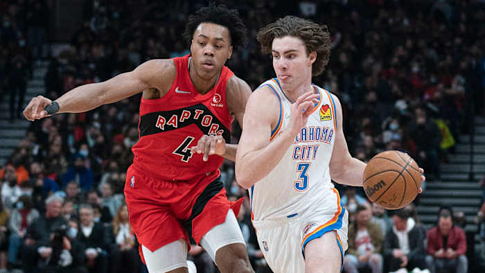 Oklahoma City Thunder guard Josh Giddey dribbles the ball as Toronto Raptors forward Scottie Barnes defends during the second quarter at Scotiabank Arena.