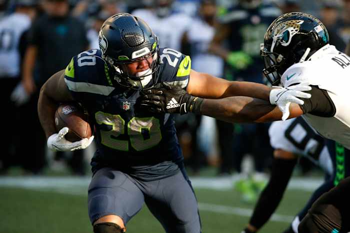 NFL: Jacksonville Jaguars at Seattle Seahawks Oct 31, 2021; Seattle, Washington, USA; Seattle Seahawks running back Rashaad Penny (20) rushes against the Jacksonville Jaguars during the fourth quarter at Lumen Field.
