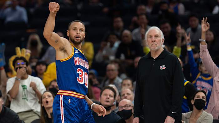 Stephen Curry shoots a three against the Spurs