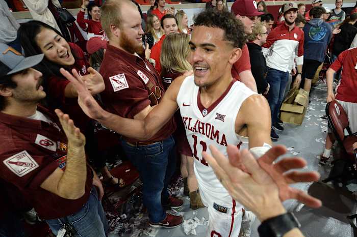 Oklahoma Sooners guard Trae Young (11) is greeted by fans after defeating the Kansas State Wildcats at Lloyd Noble Center.