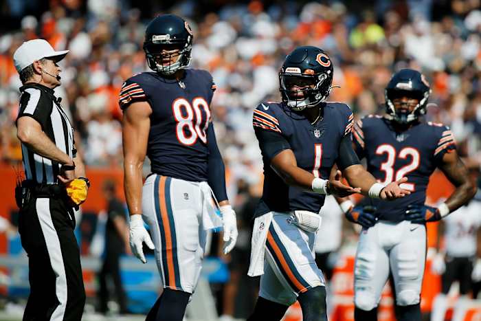 Sep 19, 2021; Chicago, Illinois, USA; Chicago Bears quarterback Justin Fields (1) argues a call with referee Land Clark (130) after a false start penalty during the third quarter of their game against the Cincinnati Bengals at Soldier Field. Mandatory Credit: Jon Durr-USA TODAY Sports