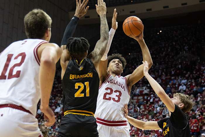 Indiana forward Trayce Jackson-Davis (23) shoots the ball while Northern Kentucky forward Chris Brandon (21) and guard Sam Vinson (2) defend. (Trevor Ruszkowski-USA TODAY Sports)
