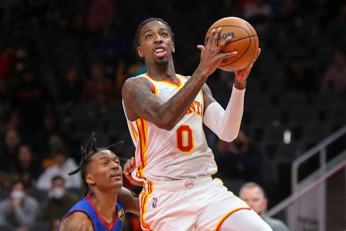 Atlanta Hawks guard Delon Wright shoots a layup against the Denver Nuggets.