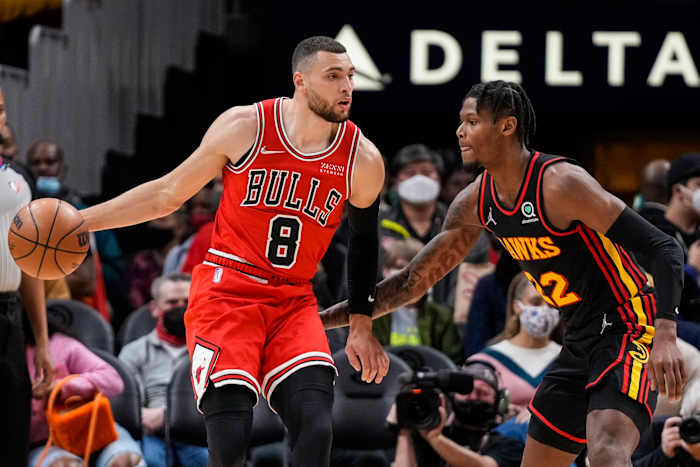 Dec 27, 2021; Atlanta, Georgia, USA; Chicago Bulls guard Zach LaVine (8) controls the ball in front of Atlanta Hawks forward Cam Reddish (22) during the first half at State Farm Arena.