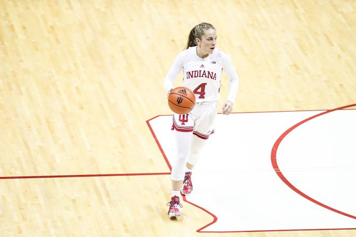 Nicole Cardaño-Hillary takes the ball up the court.