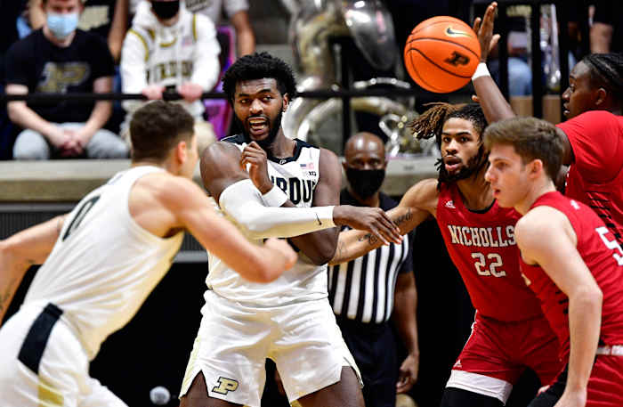Trevion Williams passes the ball away from a Nicholls State defender.