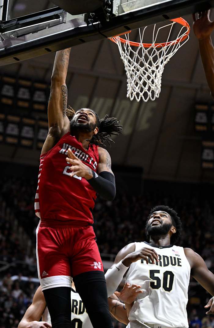 A Nicholls State player goes up for the layup in front of Trevion Williams.