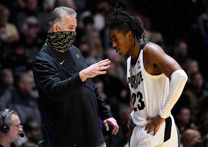 Coach Painter talks to Jaden Ivey on the sidelines.