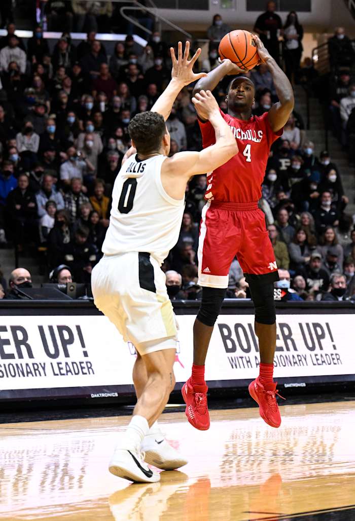 A Nicholls State players shoots the ball over Mason Gillis.