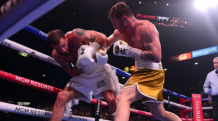 Canelo Álvarez (right) is Sports Illustrated's 2021 Fighter of the Year.